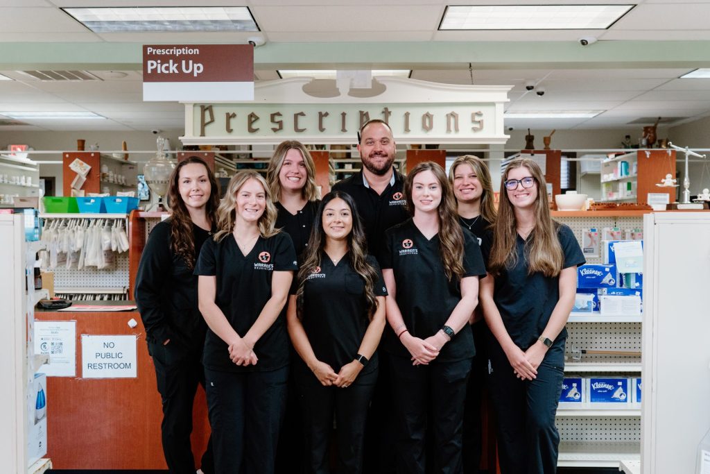 Employees of Pharmacy Team in Uniform inside Warren's Drug Store