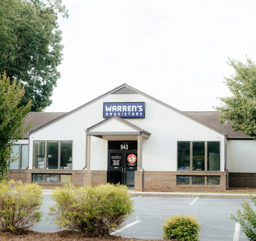 The Warren's Drug Store and pharmacy in Mebane building and entrance with sign