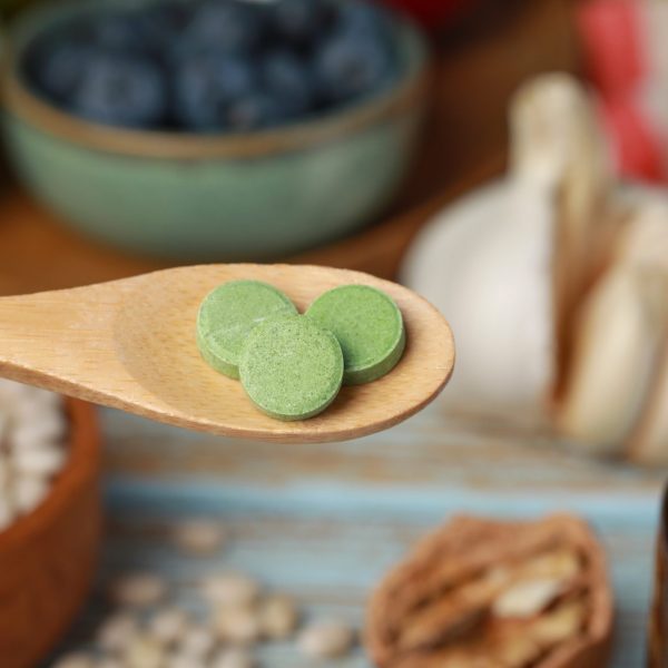 Supplements on wood spoon