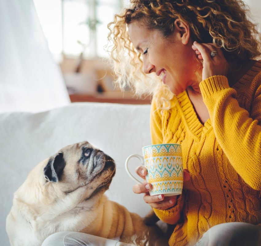 Woman home with pet dog after doing hormone test