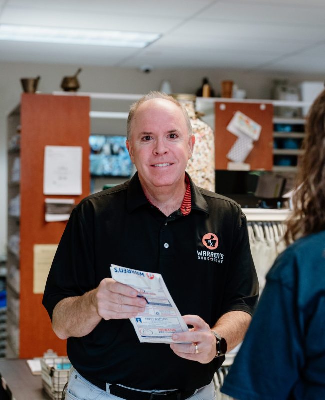 Jim, RPh at warren's drug store counter