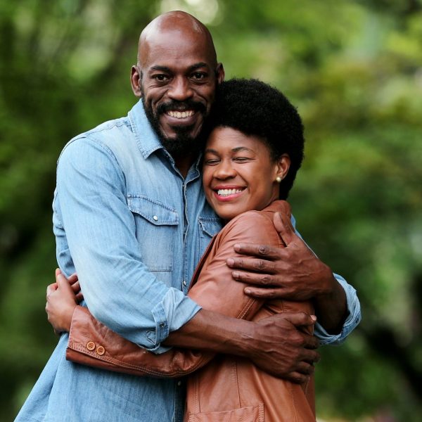 Couple hugging outdoors near Burlington