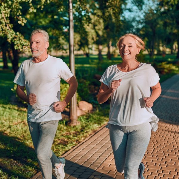 Couple running in park near Hillsborough