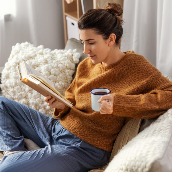 Woman reads a book about health beyond medication