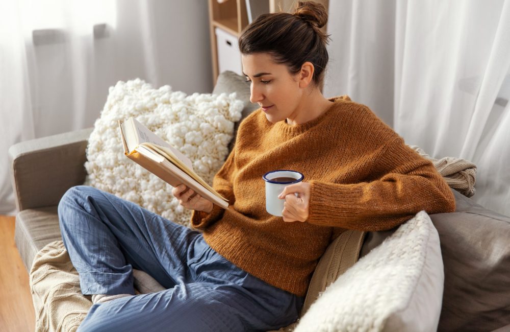 Woman reads a book about health beyond medication