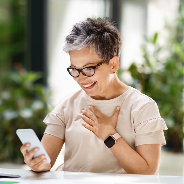 Older woman receiving telehealth on phone