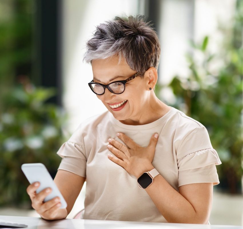 Older woman receiving telehealth on phone